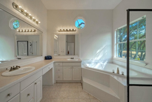 bathroom with plenty of natural light, vanity, plus walk in shower, and tile patterned floors