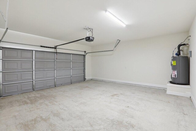 125 Callie St, Smithville, TX 78957 - garage featuring water heater, baseboards, and a garage door opener