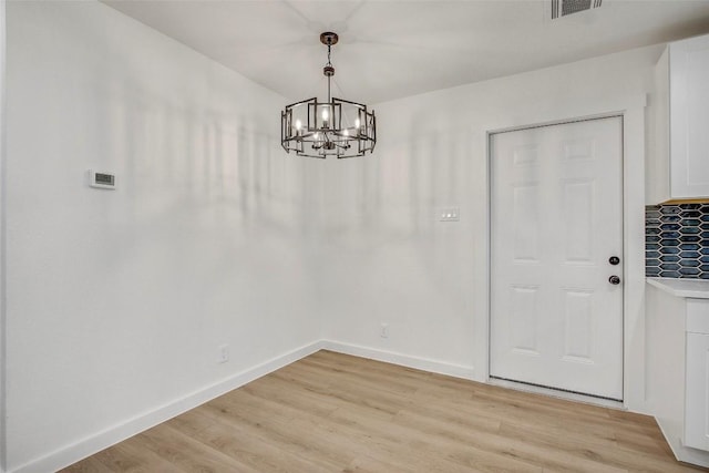 1402 Valleyridge Cir, Austin, TX 78704 - unfurnished dining area with a chandelier and light wood-type flooring