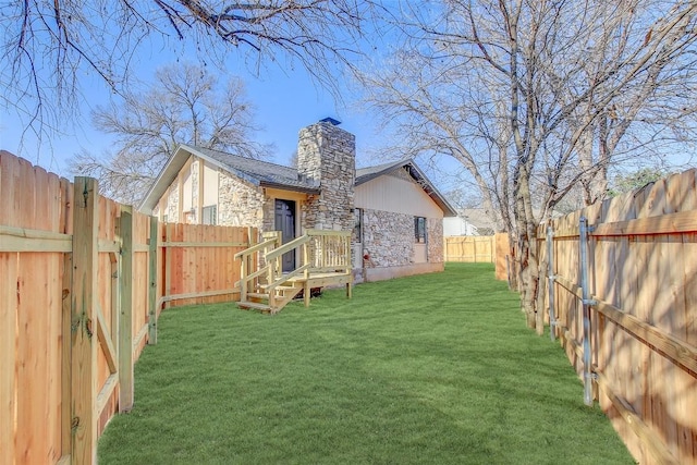 1402 Valleyridge Cir, Austin, TX 78704 - back of house with stone siding, a chimney, and a fenced backyard