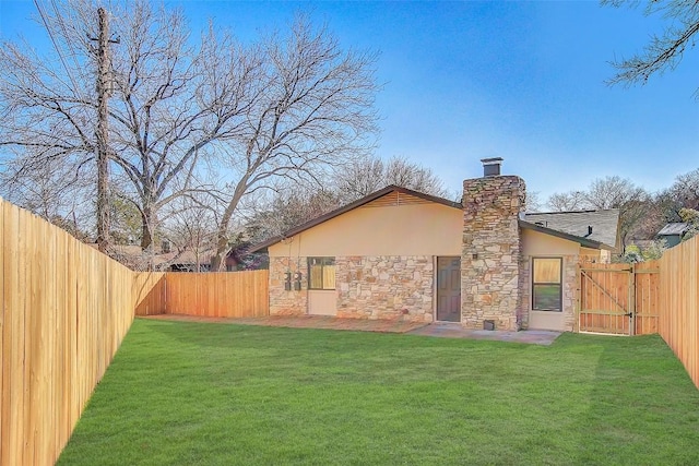 1402 Valleyridge Cir, Austin, TX 78704 - rear view of property with stone siding, a fenced backyard, a chimney, and stucco siding