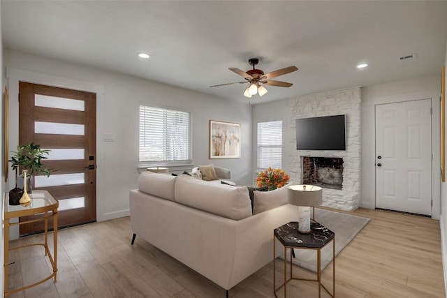 1402 Valleyridge Cir, Austin, TX 78704 - living room featuring light wood-type flooring, a ceiling fan, a fireplace, and recessed lighting
