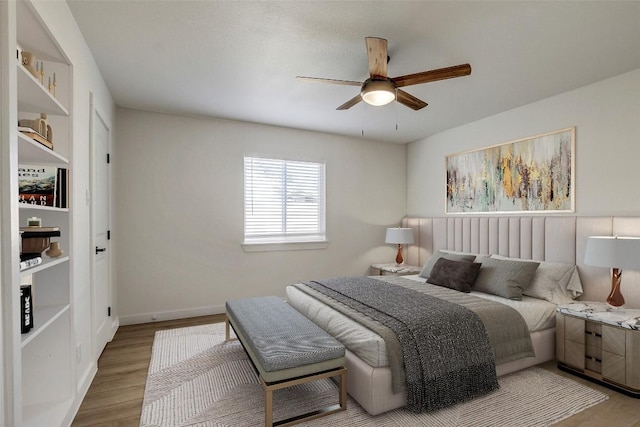 1402 Valleyridge Cir, Austin, TX 78704 - bedroom with wood finished floors and a ceiling fan