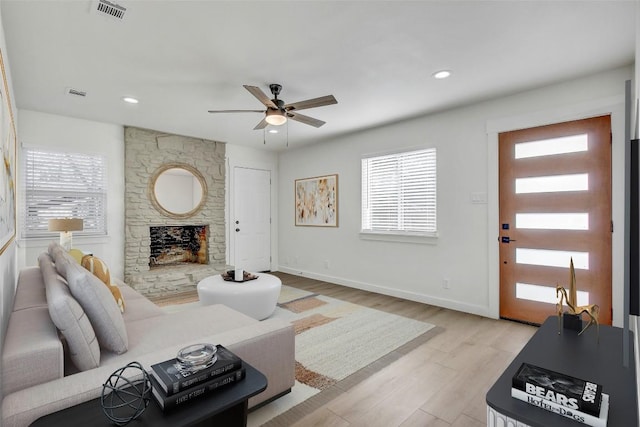 1402 Valleyridge Cir, Austin, TX 78704 - living room with ceiling fan, light wood-type flooring, a fireplace, and recessed lighting
