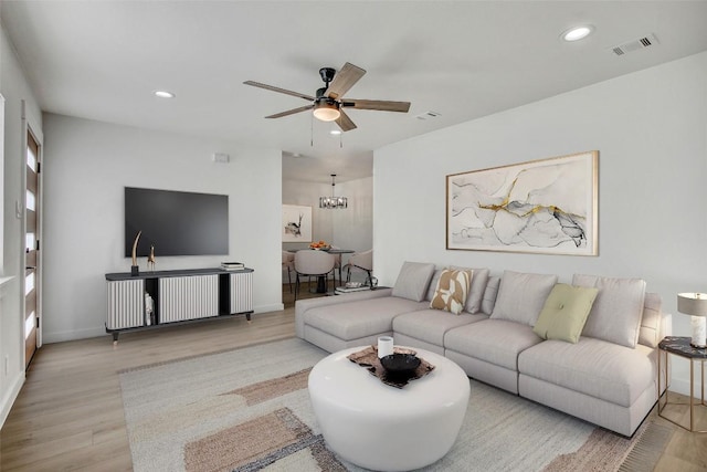 1402 Valleyridge Cir, Austin, TX 78704 - living room with wood finished floors, a ceiling fan, recessed lighting, and a chandelier