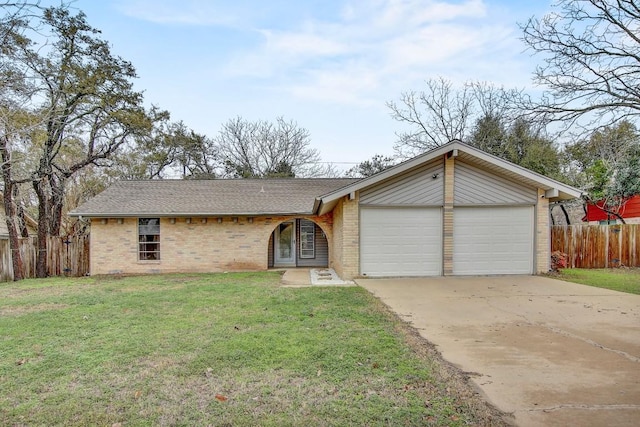 ranch-style house with a front yard and a garage