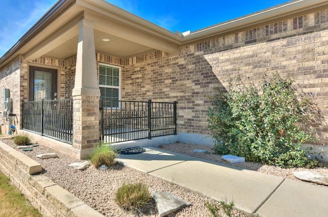 220 Comal Ln, Georgetown, TX 78633 - view of exterior entry featuring brick siding and covered porch