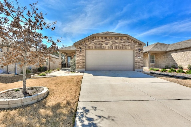 220 Comal Ln, Georgetown, TX 78633 - view of front of house with brick siding, driveway, and a garage