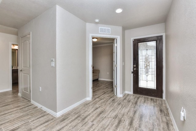 foyer with light wood-type flooring