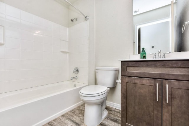 full bathroom featuring vanity, bathing tub / shower combination, toilet, and hardwood / wood-style floors