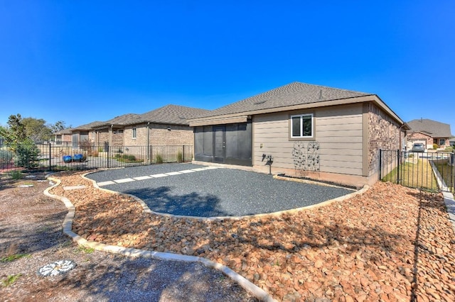 rear view of property with a patio area