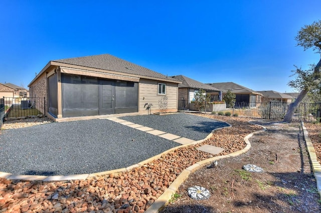 view of front of home featuring a patio area and a sunroom