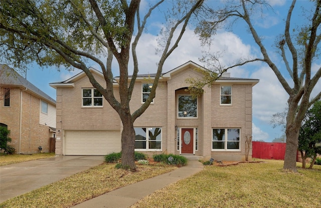 view of front of property with a front yard and a garage