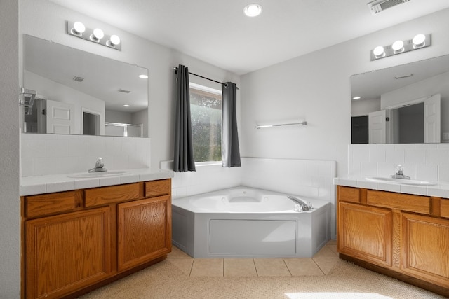 bathroom with separate shower and tub, vanity, tile patterned floors, and backsplash