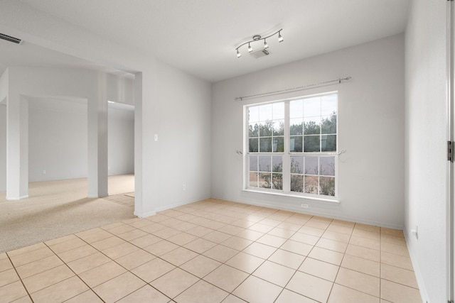 unfurnished room with light tile patterned floors