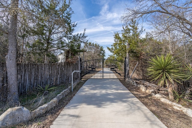 view of gate featuring fence