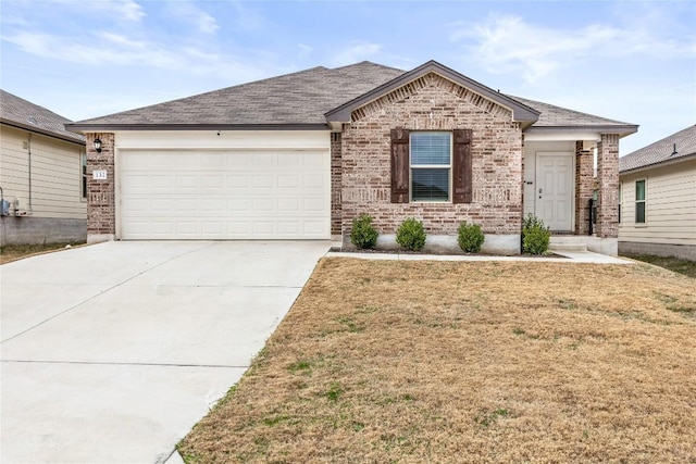 view of front of home with a front lawn and a garage