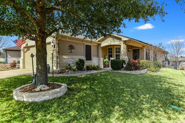 view of front of property with concrete driveway, a front yard, stucco siding, stone siding, and an attached garage