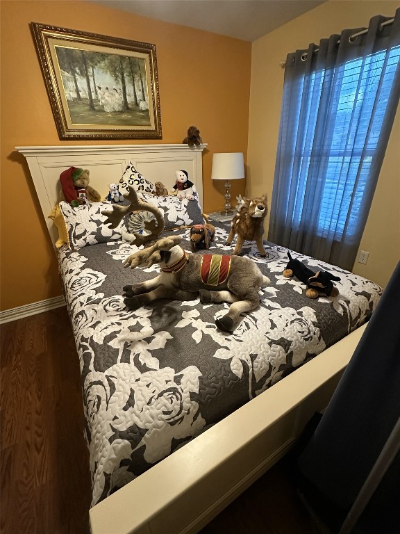 bedroom featuring dark wood-type flooring