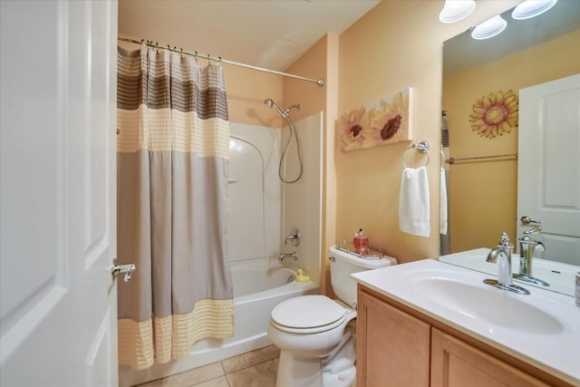 full bathroom featuring tile patterned floors, shower / bath combo with shower curtain, toilet, and vanity