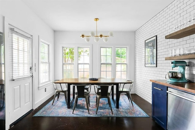 1508 E 11th St, Austin, TX 78702 - dining room with a chandelier and baseboards