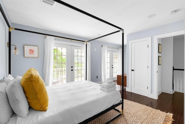 1508 E 11th St, Austin, TX 78702 - bedroom featuring french doors, access to outside, wood finished floors, and multiple windows