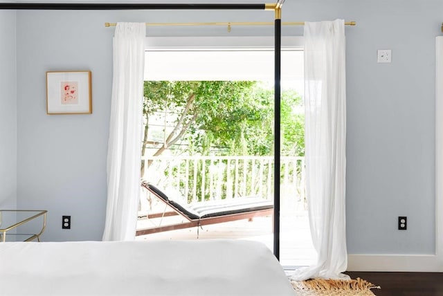 1508 E 11th St, Austin, TX 78702 - bedroom featuring wood finished floors and access to outside