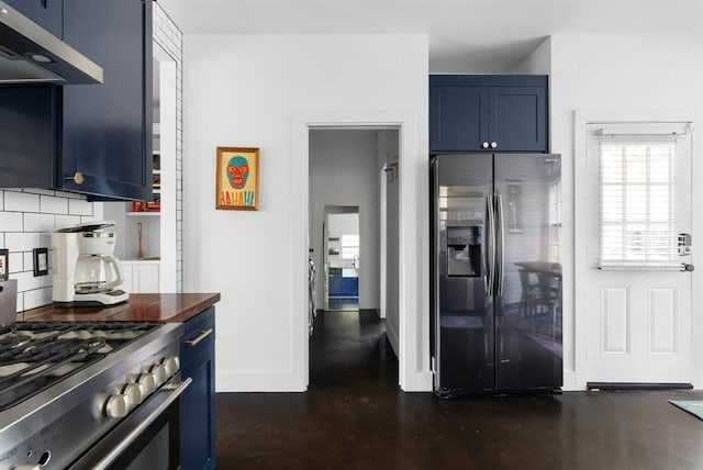 1508 E 11th St, Austin, TX 78702 - kitchen with stainless steel appliances, blue cabinetry, exhaust hood, and decorative backsplash