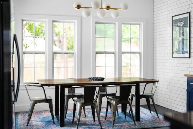 1508 E 11th St, Austin, TX 78702 - dining space with a chandelier and tile walls