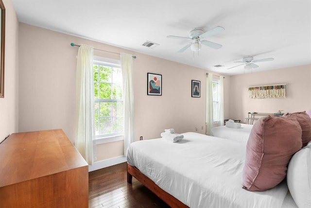 1508 E 11th St, Austin, TX 78702 - bedroom with dark wood-style flooring and a ceiling fan