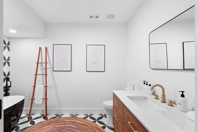 1508 E 11th St, Austin, TX 78702 - full bathroom with a soaking tub, tile patterned floors, and vanity