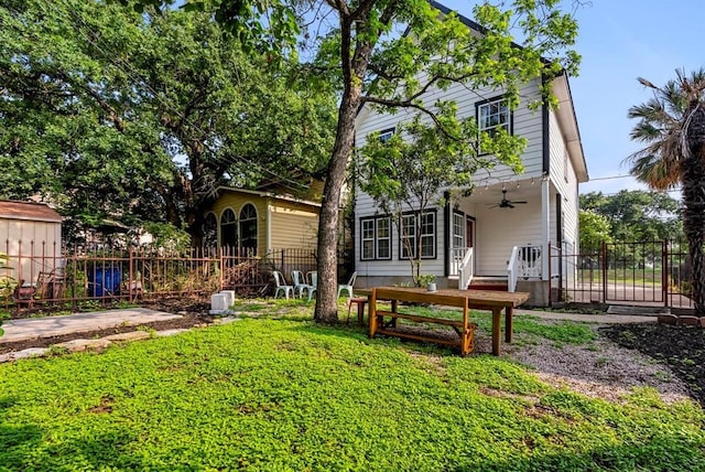 1508 E 11th St, Austin, TX 78702 - back of house with ceiling fan and a gate
