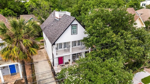 1508 E 11th St, Austin, TX 78702 - view of front of house featuring a shingled roof and a balcony