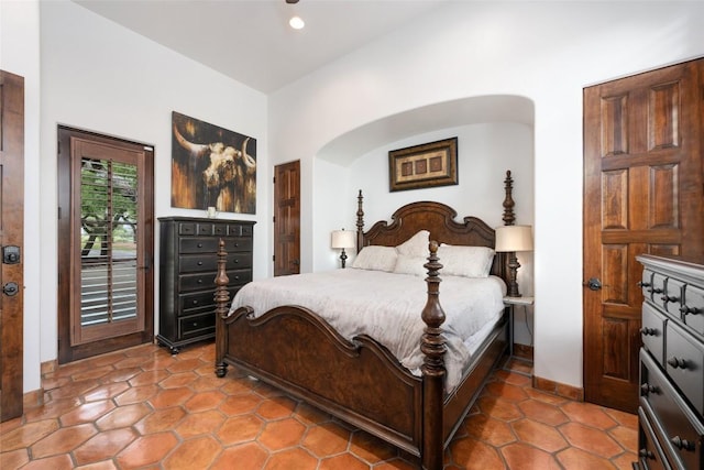 tiled bedroom featuring access to outside, baseboards, and recessed lighting