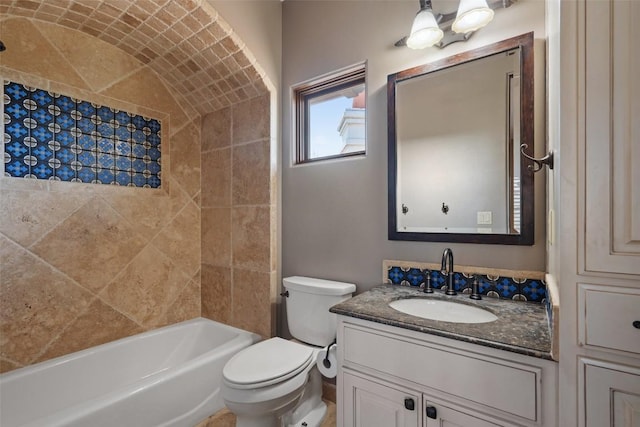 bathroom featuring vanity, shower / tub combination, and toilet