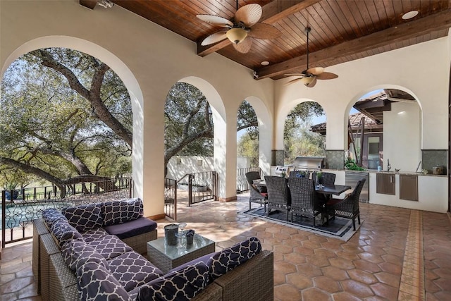 view of patio / terrace with ceiling fan, area for grilling, grilling area, fence, and outdoor dining area