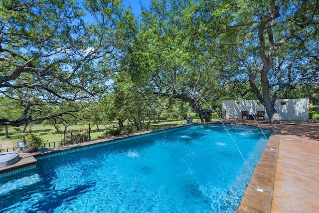 view of swimming pool featuring a fenced in pool and fence