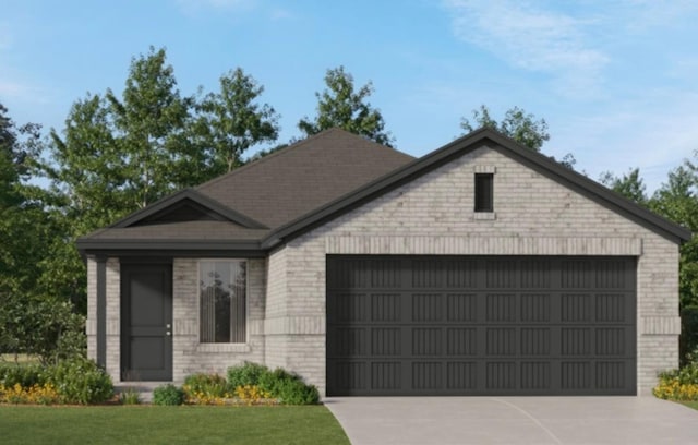 view of front of house with a front lawn and a garage