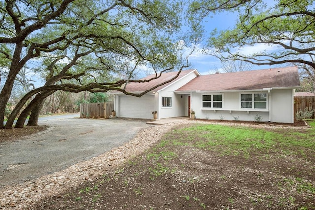 ranch-style home with a garage