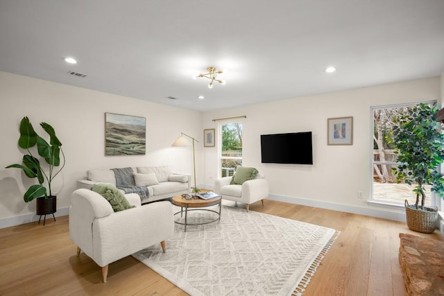 living room with light hardwood / wood-style flooring