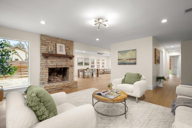 1907 Casa Grande Dr, Austin, TX 78733 - living room with wood finished floors, recessed lighting, and a fireplace
