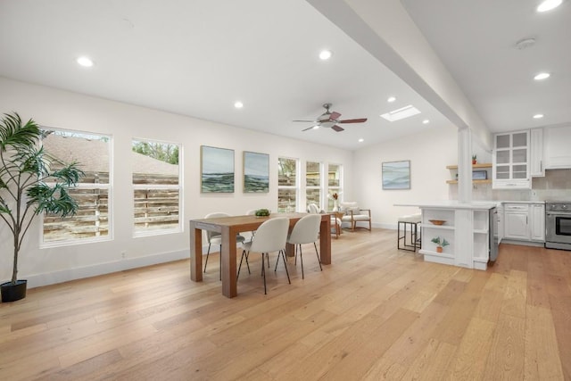 1907 Casa Grande Dr, Austin, TX 78733 - dining area featuring healthy amount of natural light, light wood-style flooring, a ceiling fan, recessed lighting, and a skylight