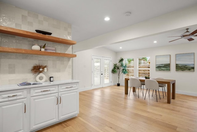 1907 Casa Grande Dr, Austin, TX 78733 - kitchen featuring light countertops, backsplash, light wood finished floors, a ceiling fan, and white cabinetry