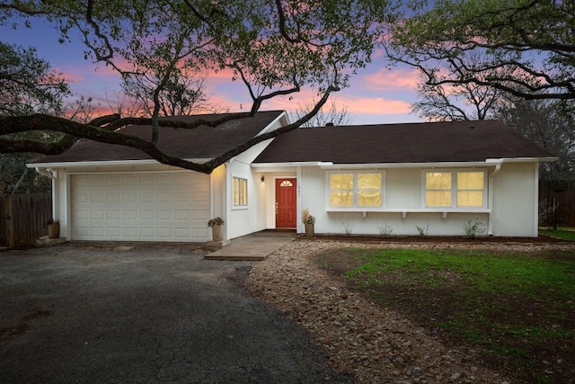 1907 Casa Grande Dr, Austin, TX 78733 - view of front of house with a garage and asphalt driveway