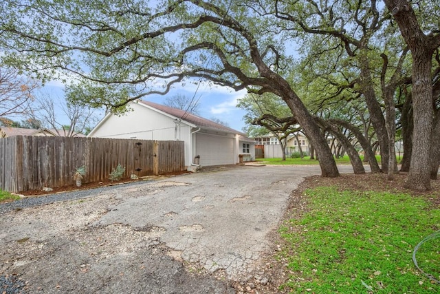 1907 Casa Grande Dr, Austin, TX 78733 - view of side of property featuring asphalt driveway