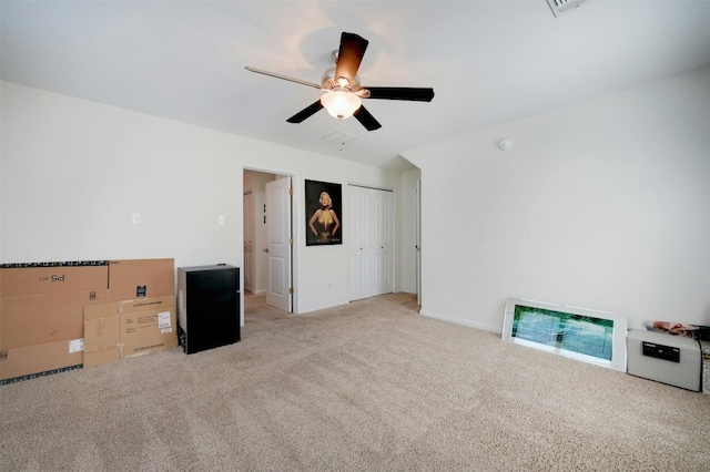 carpeted empty room with ceiling fan