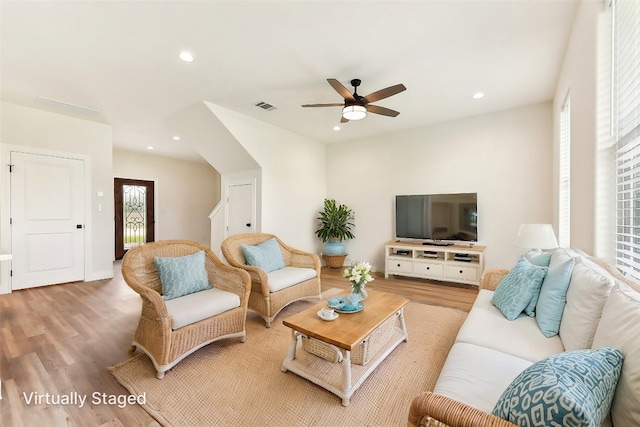 112 Callie St, Smithville, TX 78957 - living room with recessed lighting, wood finished floors, visible vents, and a ceiling fan