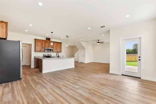 112 Callie St, Smithville, TX 78957 - kitchen with recessed lighting, light wood finished floors, appliances with stainless steel finishes, and a ceiling fan