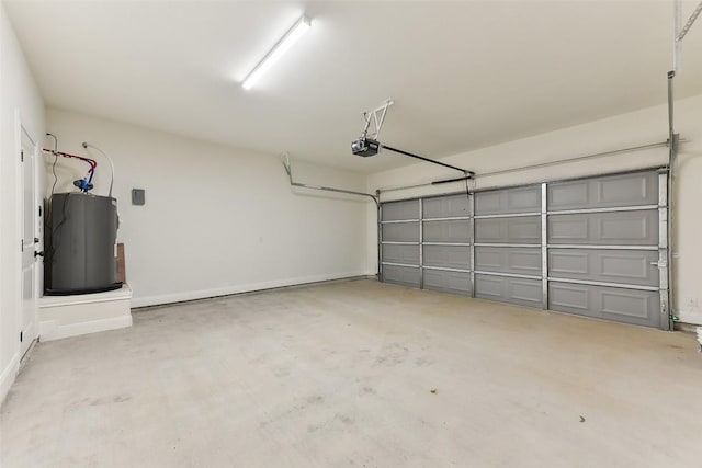 112 Callie St, Smithville, TX 78957 - garage with baseboards, water heater, and a garage door opener