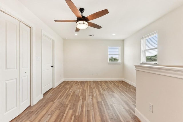 112 Callie St, Smithville, TX 78957 - unfurnished bedroom featuring a ceiling fan, a closet, light wood-style floors, baseboards, and recessed lighting